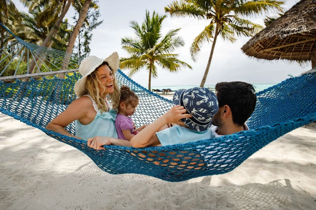 Cheerful Family Talking in Hammock at Kiwengwa Beach Zanzibar Easy Travel Tanzania 2 1